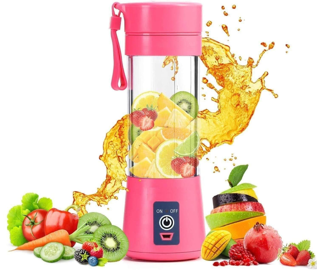 Pink portable blender with fruits and vegetables on a white background