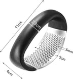 Black handheld grater with measurements on a white background