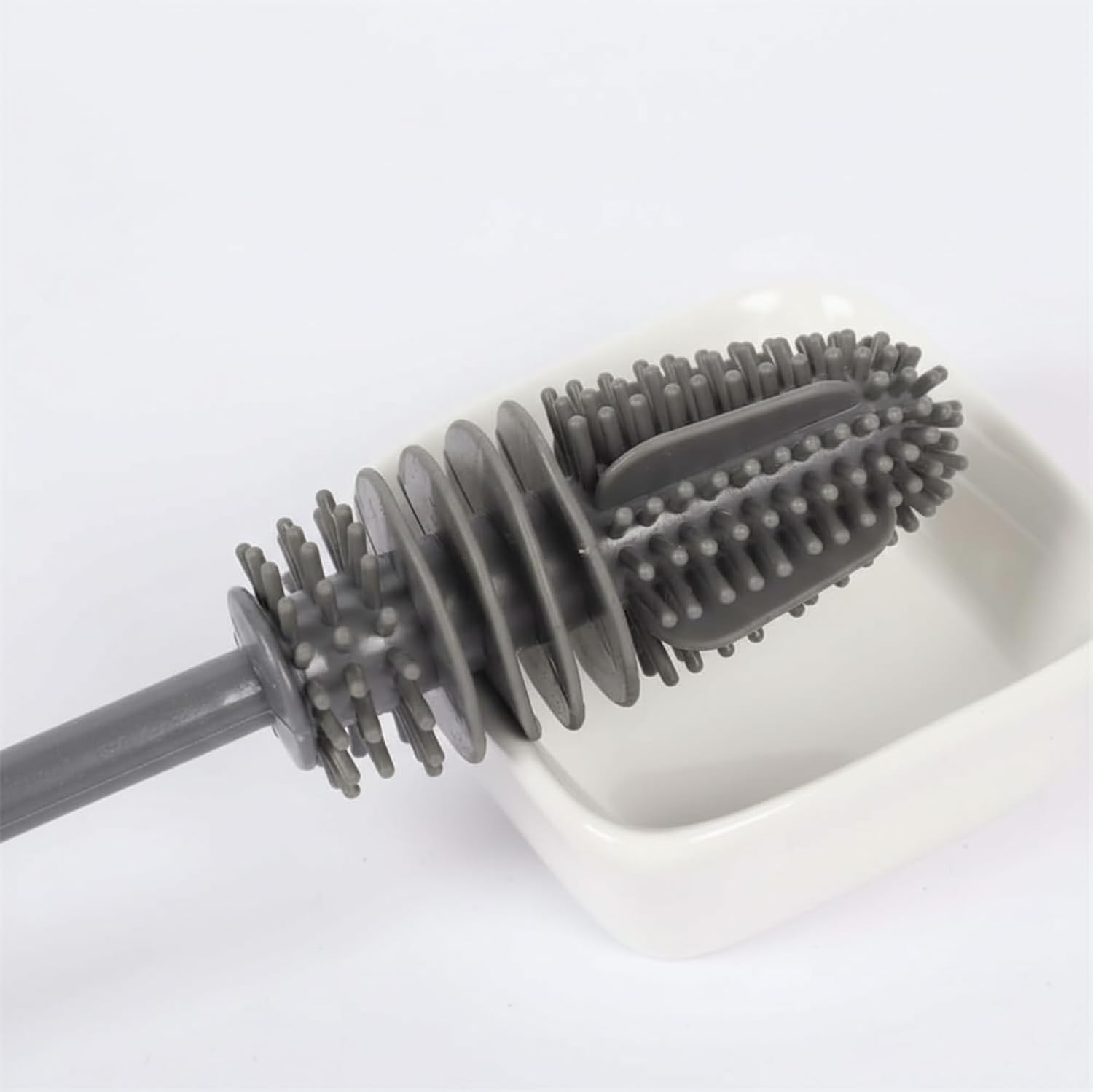 Gray scrubber brush on a white background