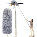 Long-handled feather duster with a fluffy head being used to clean a ceiling fan.