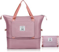 Pink travel bag with matching pouch on a white background