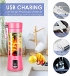 Pink portable blender with USB charging features on a white surface.