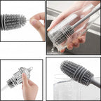 Multifunctional cleaning brush with bristle head and handle being used on a glass.
