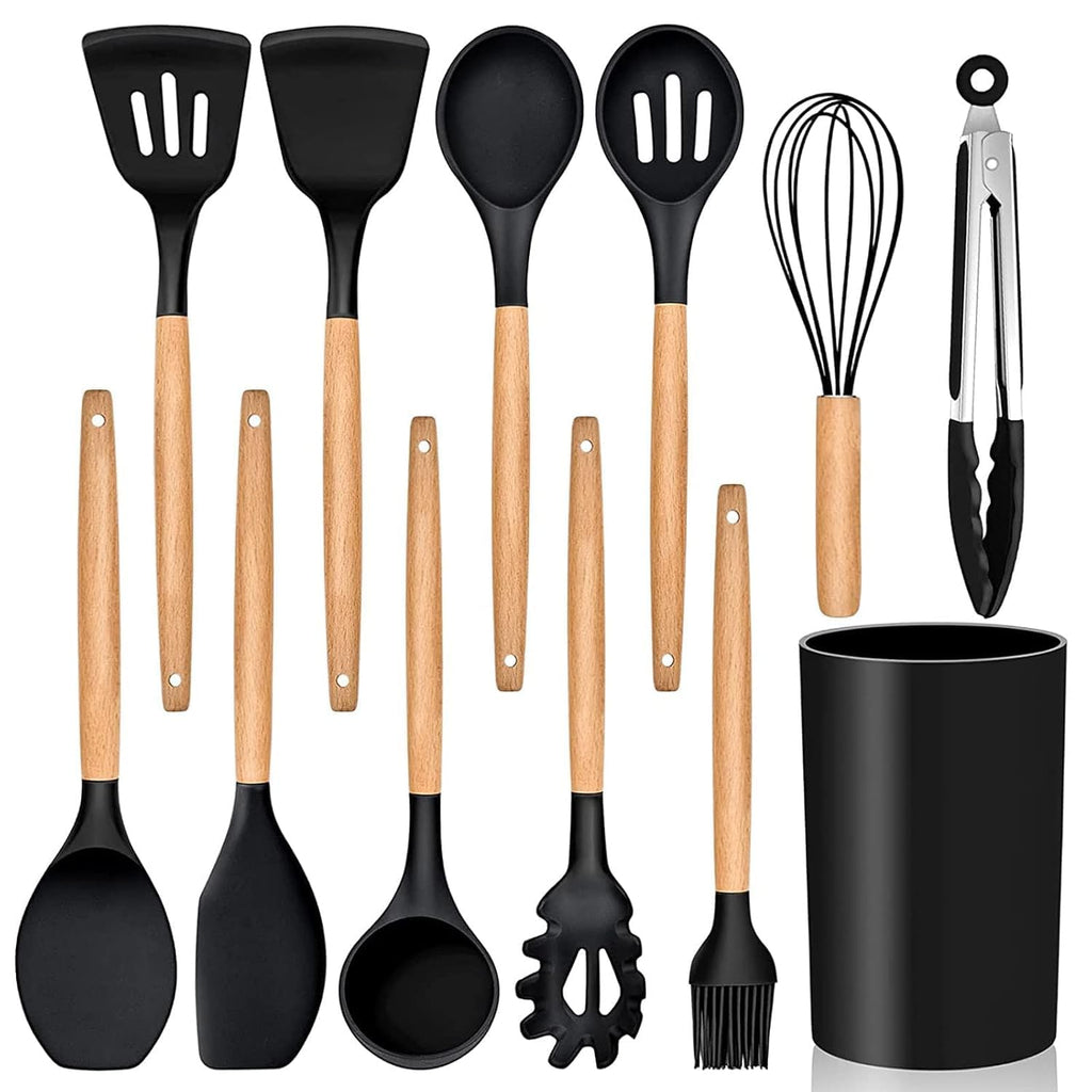 Set of kitchen utensils with wooden handles on a white background