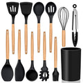 Set of kitchen utensils with wooden handles on a white background