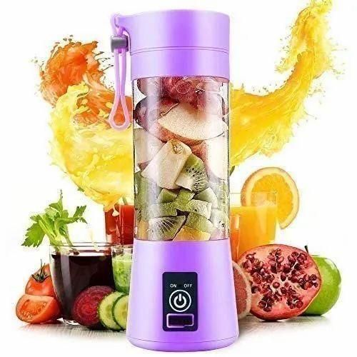 Purple portable blender with fruits and vegetables, surrounded by juice and ingredients on a white background